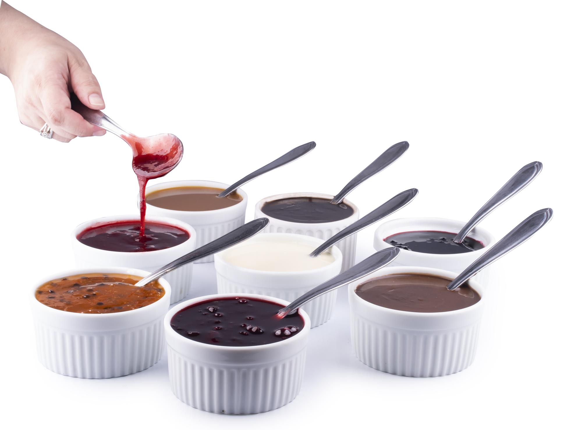 Students tasting sauce in class